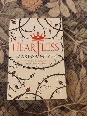 Heartless by Marissa Meyer — White Novel with Red & Black Cover